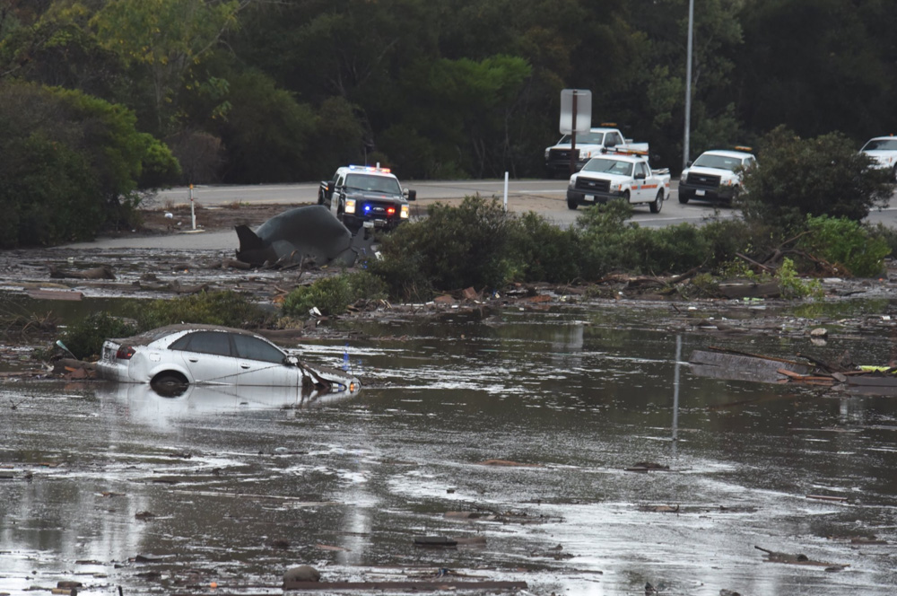 <div class='meta'><div class='origin-logo' data-origin='none'></div><span class='caption-text' data-credit='@EliasonMike/Twitter'>"The US 101 Freeway at the Olive Mill Road overpass flooded with runoff water from Montecito Creek."</span></div>