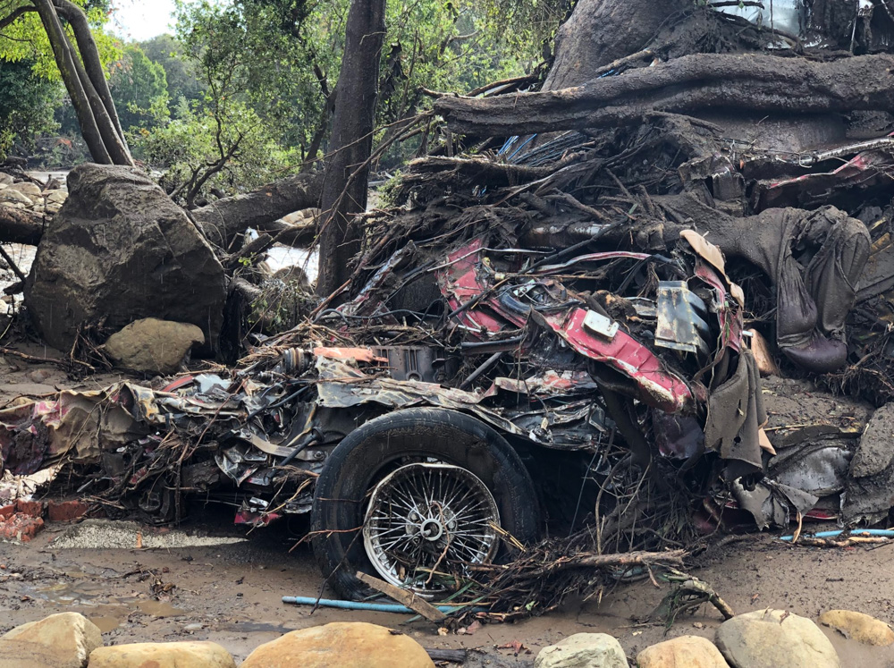 <div class='meta'><div class='origin-logo' data-origin='none'></div><span class='caption-text' data-credit='Santa Barbara County Fire'>"A vehicle was wrapped and tangled around a tree by the force of deadly flood waters on Hot Springs Road in Montecito."</span></div>