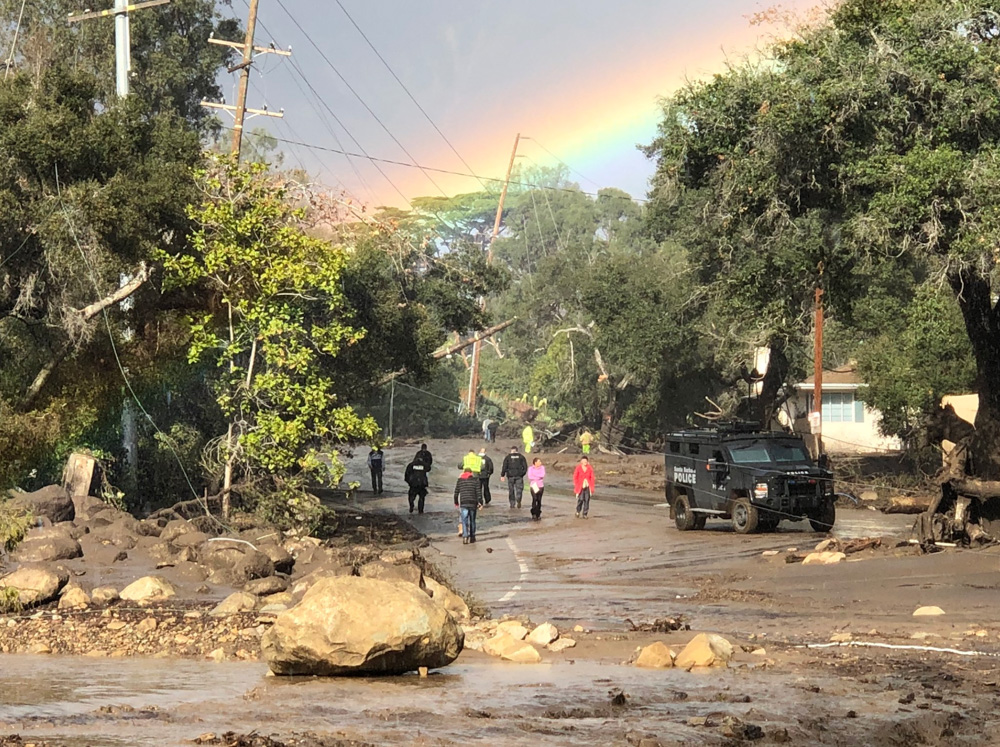 <div class='meta'><div class='origin-logo' data-origin='none'></div><span class='caption-text' data-credit='Santa Barbara County Fire'>"A rainbow forms above Montecito while law enforcement and the curious survey the destruction on Hot Springs Road in Montecito."</span></div>