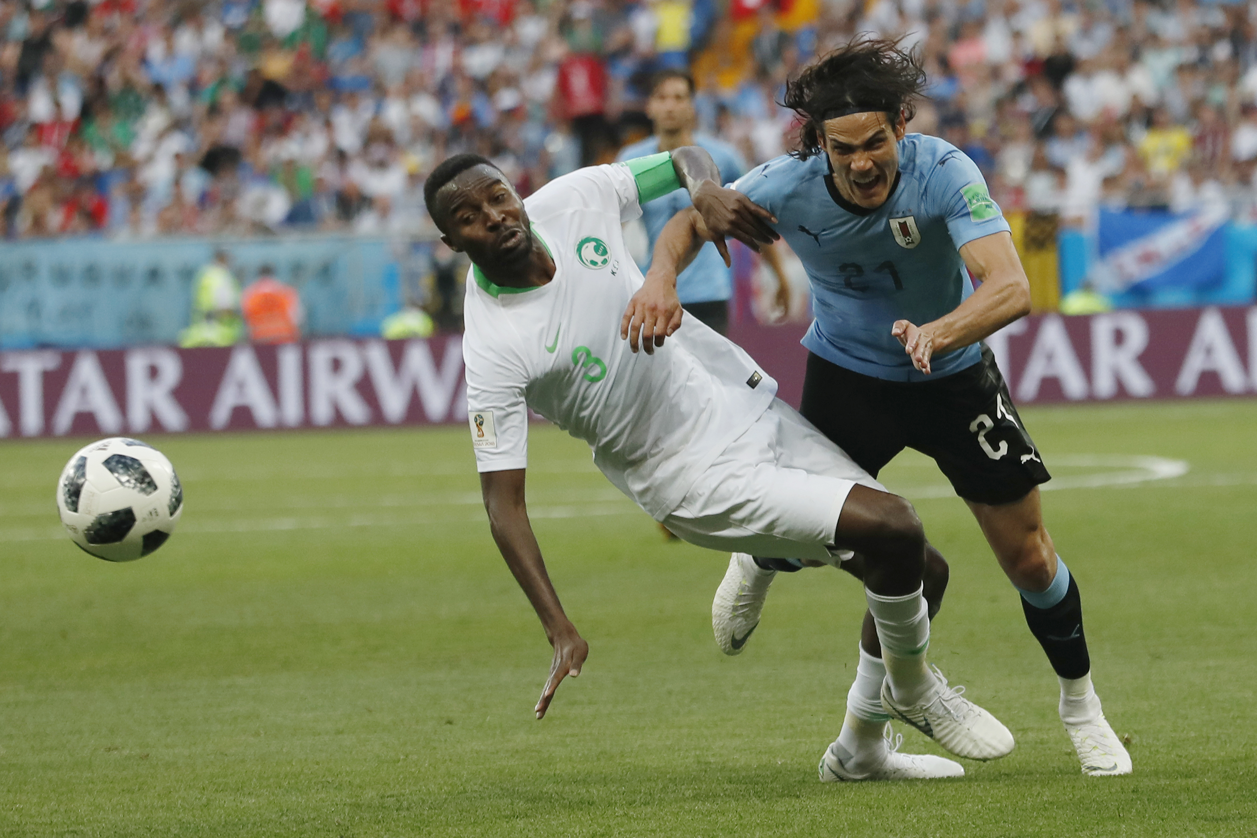 <div class='meta'><div class='origin-logo' data-origin='none'></div><span class='caption-text' data-credit='Darko Vojinovic/AP Photo'>Uruguay's Edinson Cavani, right, and Saudi Arabia's Osama Hawsawi challenge for the ball during for the group A match in Rostov Arena Wednesday, June 20, 2018.</span></div>