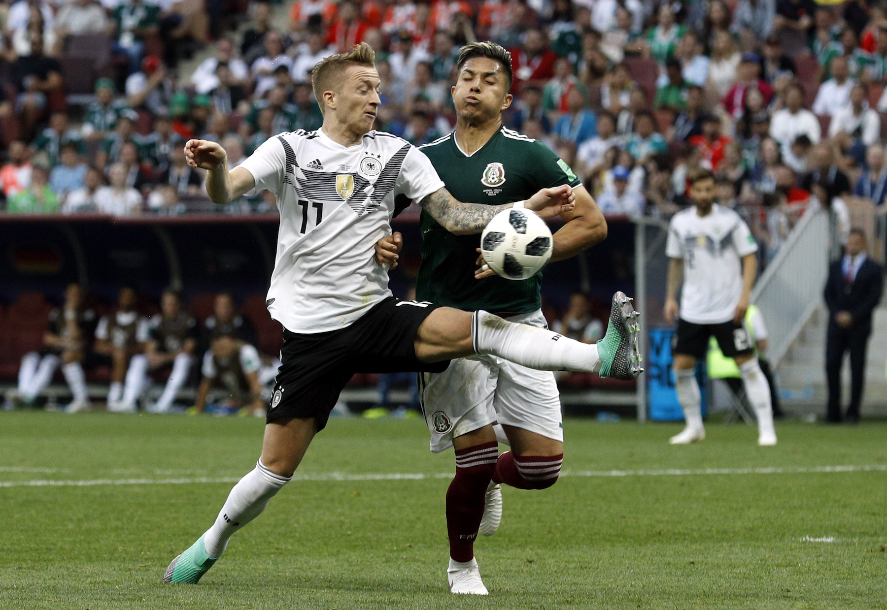 <div class='meta'><div class='origin-logo' data-origin='AP'></div><span class='caption-text' data-credit='AP Photo/Victor R. Caivano'>Germany's Marco Reus, left, fights for the ball with Mexico's Carlos Salcedo during the group F match between Germany and Mexico at the 2018 soccer World Cup.</span></div>