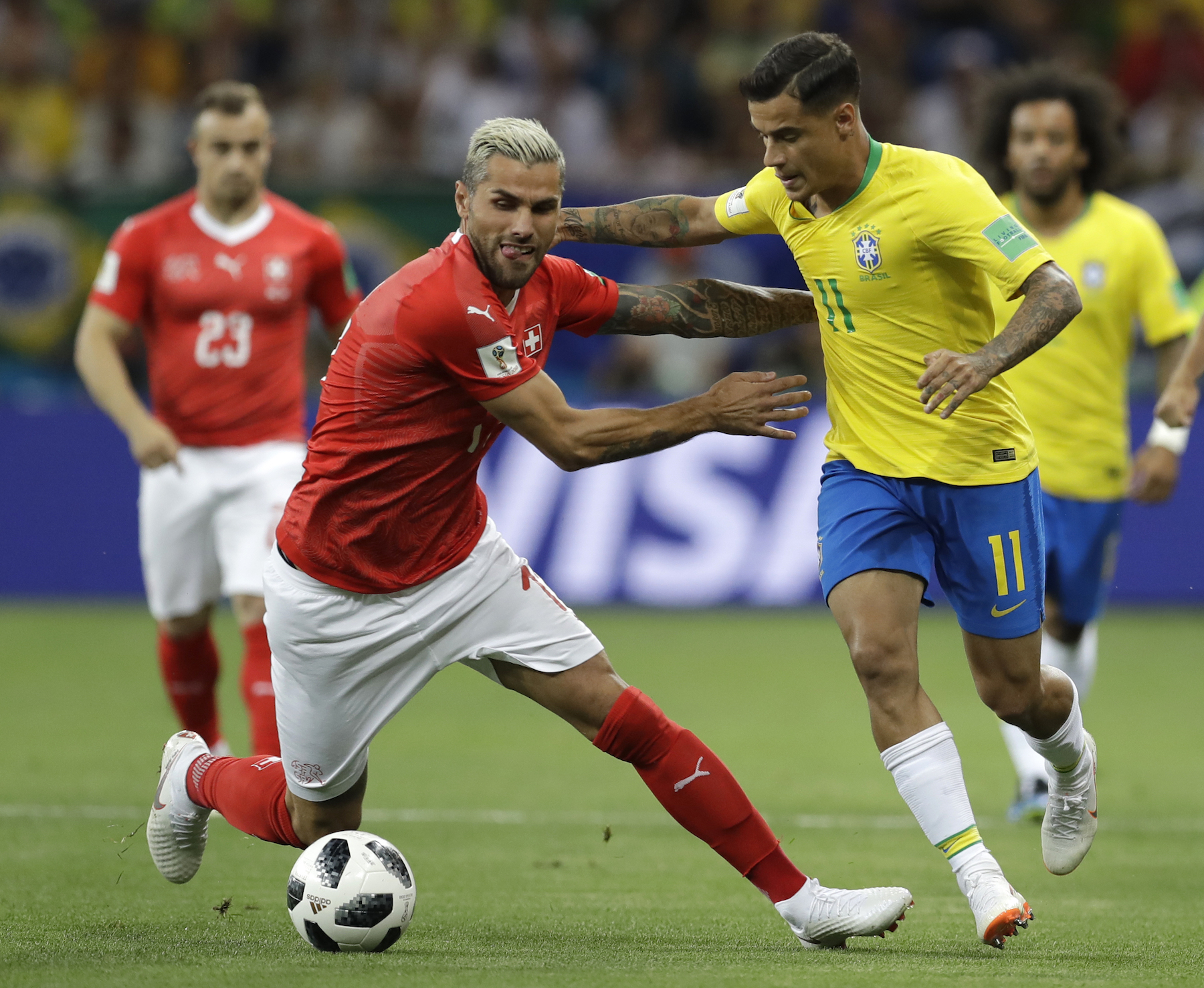 <div class='meta'><div class='origin-logo' data-origin='AP'></div><span class='caption-text' data-credit='AP Photo/Themba Hadebe'>Switzerland's Valon Behrami, left, and Brazil's Philippe Coutinho challenge for the ball during the group E match between Brazil and Switzerland at the 2018 soccer World Cup.</span></div>