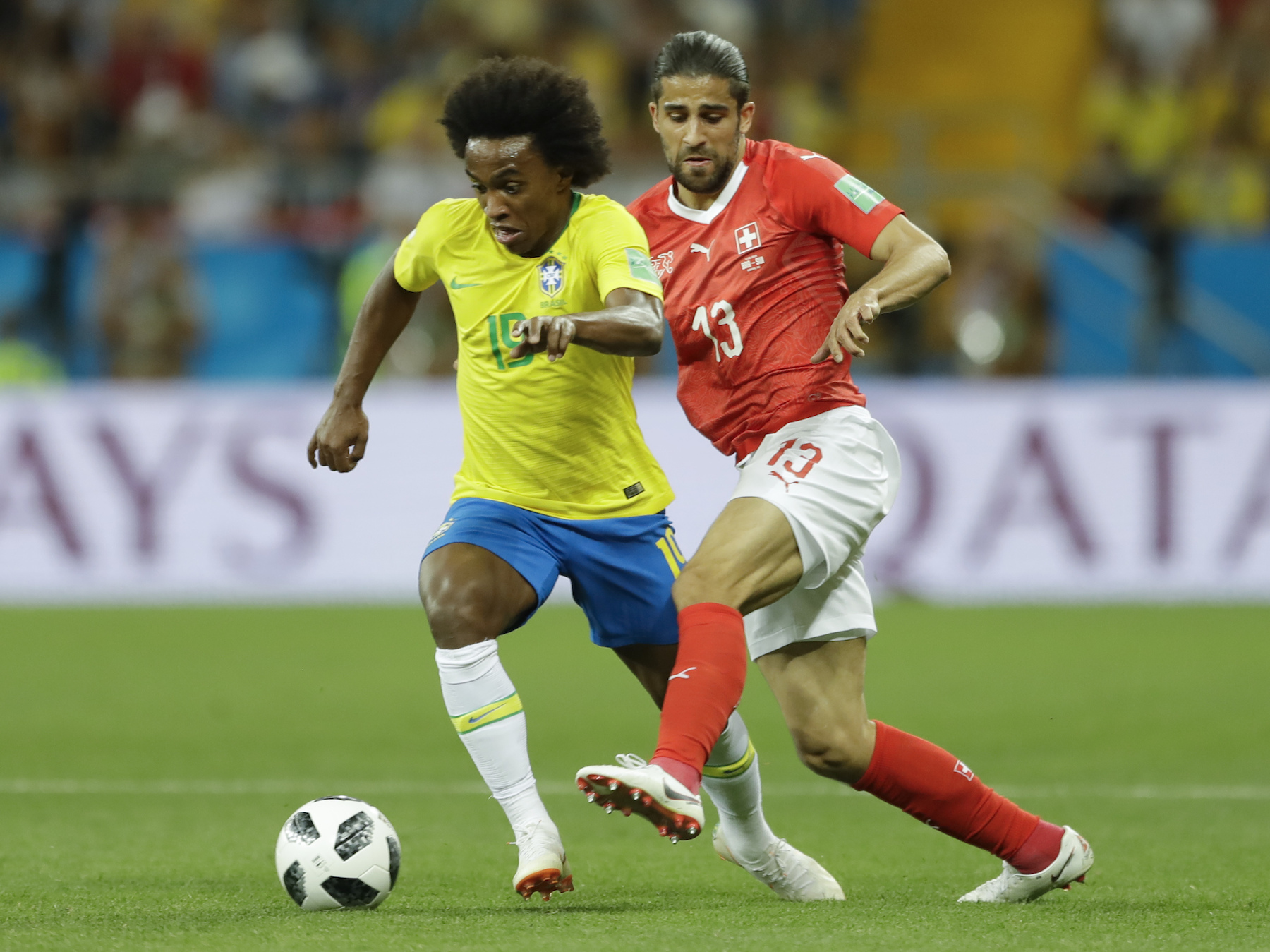 <div class='meta'><div class='origin-logo' data-origin='AP'></div><span class='caption-text' data-credit='AP Photo/Andre Penner'>Brazil's Paulinho, left, is challenged by Switzerland's Ricardo Rodriguez during their group E match at the 2018 soccer World Cup in the Rostov Arena in Rostov-on-Don, Russia.</span></div>
