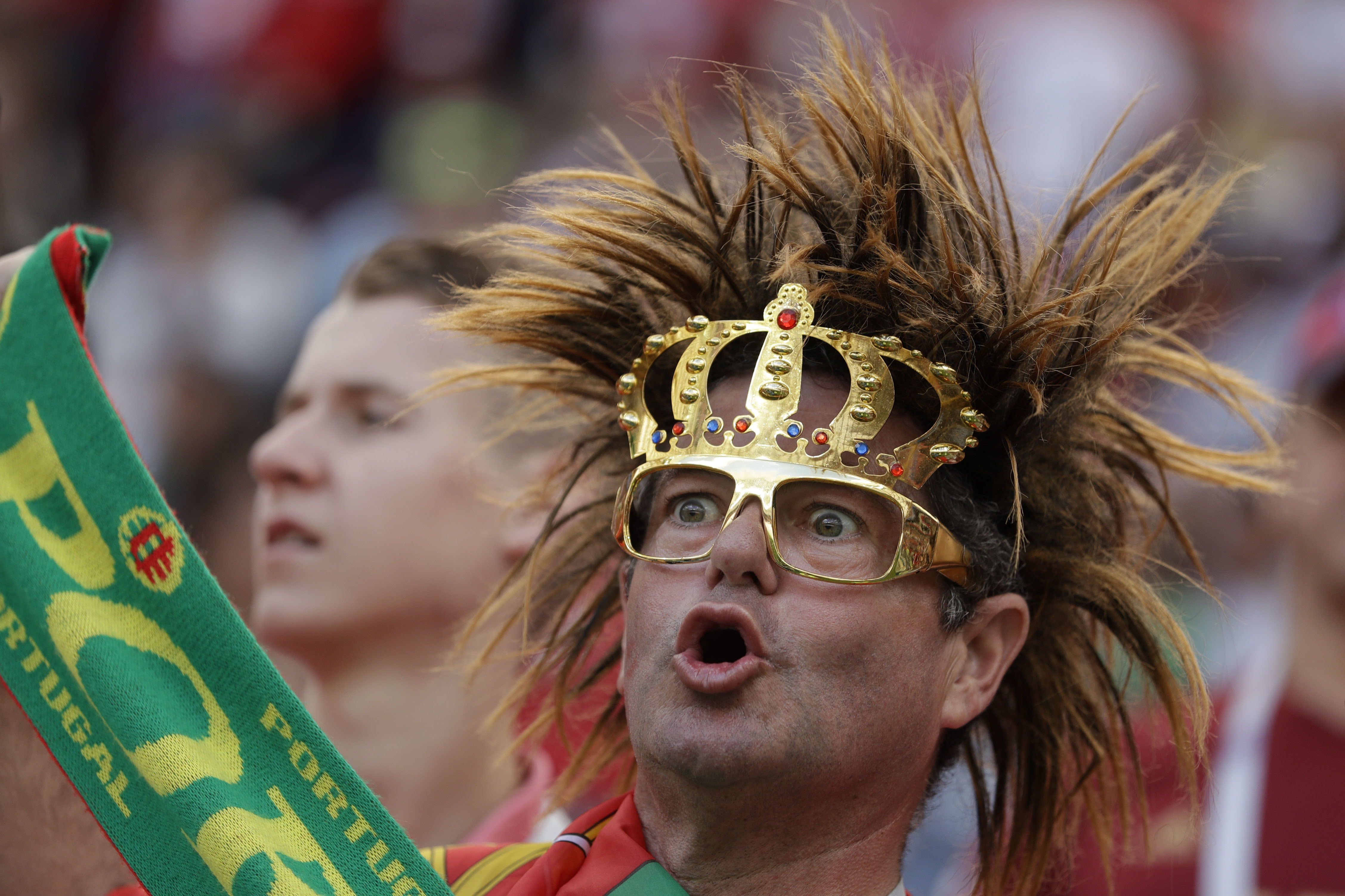 <div class='meta'><div class='origin-logo' data-origin='none'></div><span class='caption-text' data-credit='Matthias Schrader/AP Photo'>A supporter of Portugal cheers prior to the group B match between Portugal and Morocco in the Luzhniki Stadium in Moscow, Russia, Wednesday, June 20, 2018.</span></div>