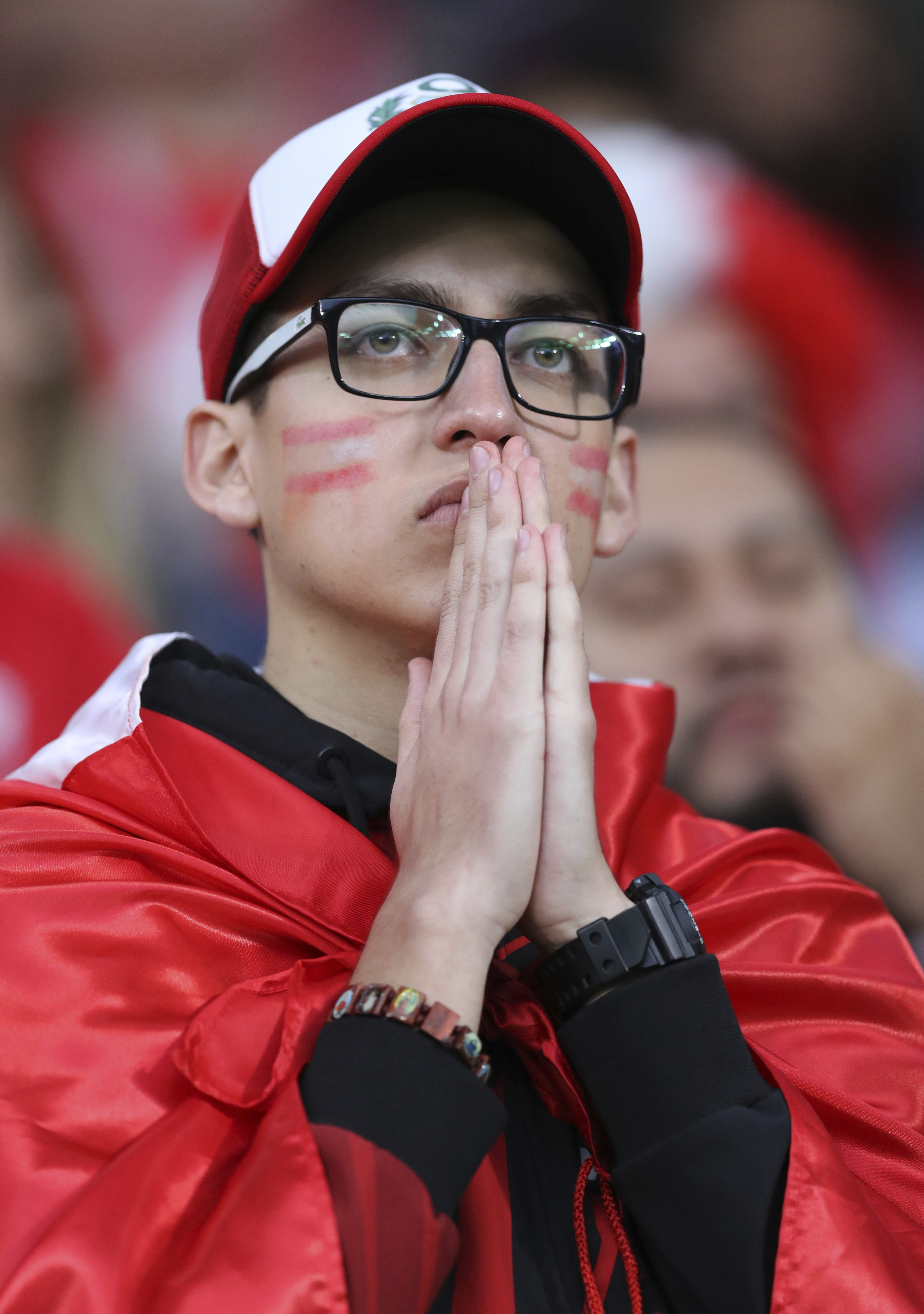 <div class='meta'><div class='origin-logo' data-origin='none'></div><span class='caption-text' data-credit='David Vincent/AP Photo'>A Peruvian fan watches the game from stands during the group C match between France and Peru  in the Yekaterinburg Arena in Yekaterinburg, Russia on June 21, 2018.</span></div>