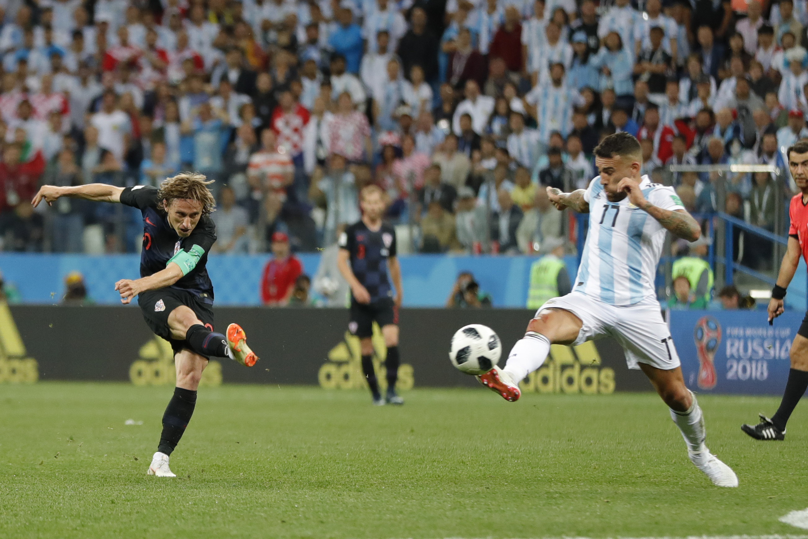 <div class='meta'><div class='origin-logo' data-origin='none'></div><span class='caption-text' data-credit='Ricardo Mazalan/AP Photo'>Croatia's Luka Modric, left, shoots the ball to score his side's second goal during the group D match between Argentina and Croatia in Nizhny Novgorod Stadium on June 21.</span></div>