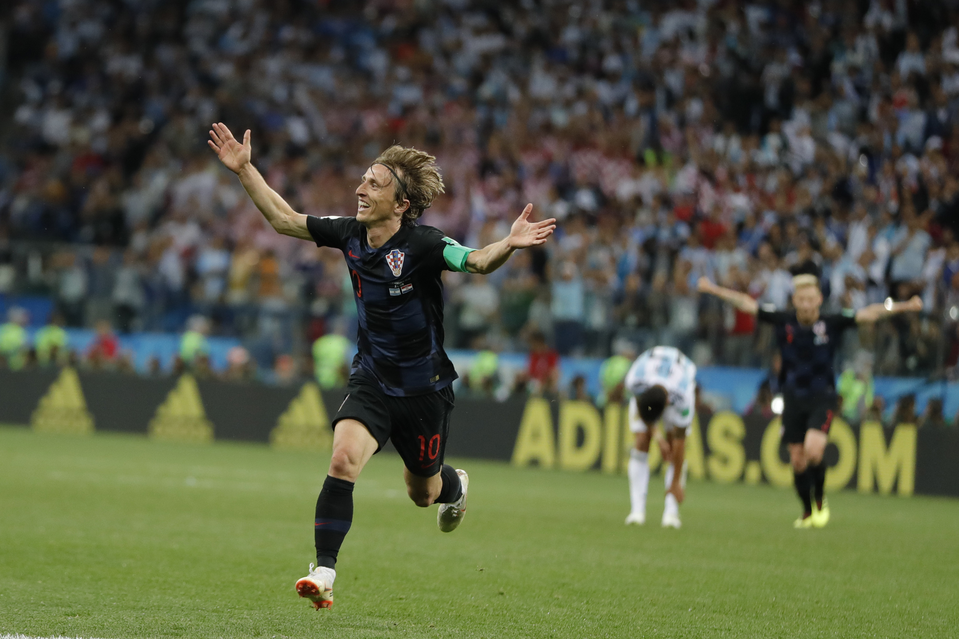 <div class='meta'><div class='origin-logo' data-origin='none'></div><span class='caption-text' data-credit='Ricardo Mazalan/AP Photo'>Croatia's Luka Modric celebrates with teammates after scoring during the group D match against Argentina on Thursday, June 21, 2018. Modric scored once in Croatia's 3-0 victory.</span></div>