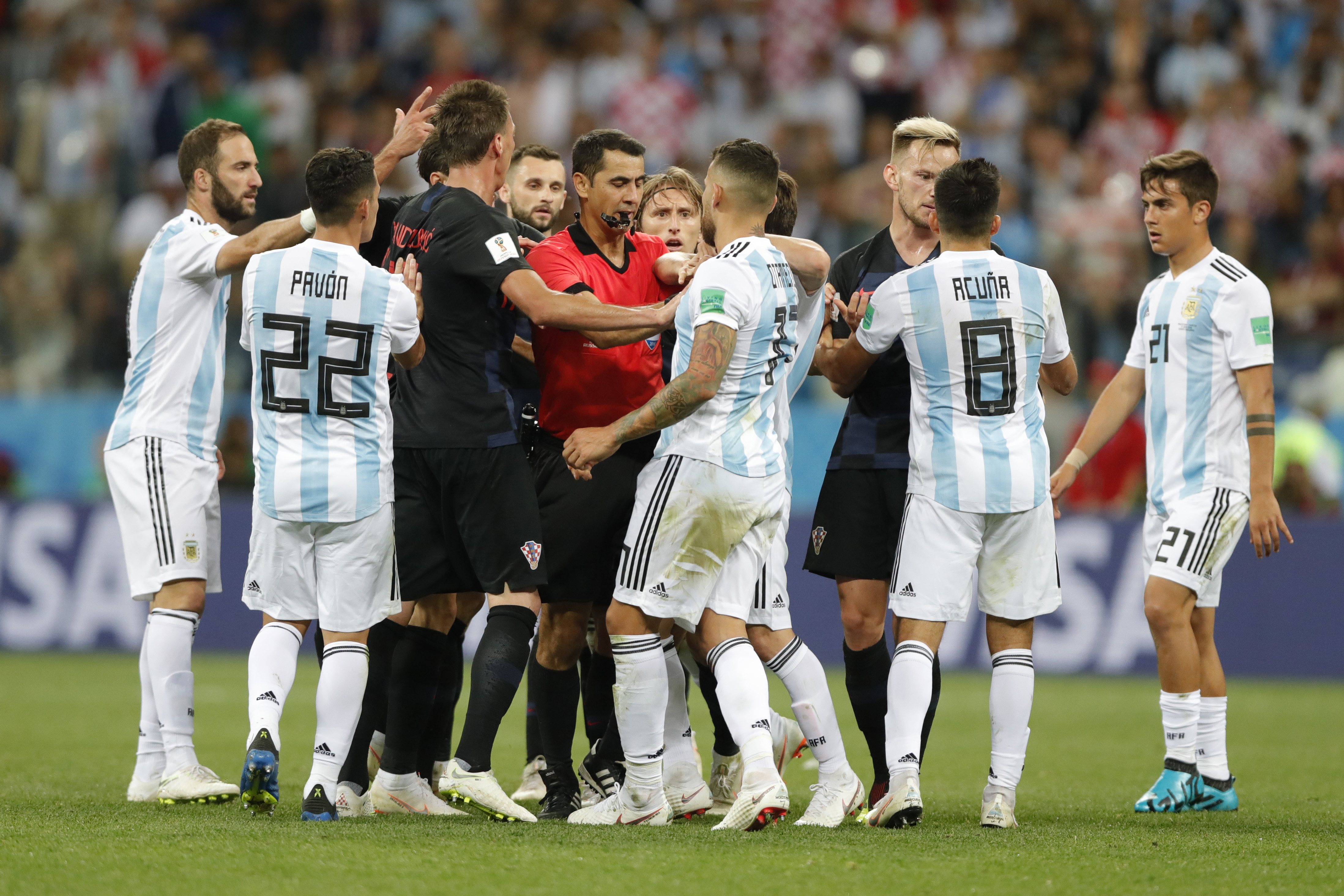 <div class='meta'><div class='origin-logo' data-origin='none'></div><span class='caption-text' data-credit='Ricardo Mazalan/AP Photo'>Croatia and Argentina players scuffle during the group D match in Nizhny Novgorod Stadium on June 21, 2018. Croatia defeated Argentina 3-0.</span></div>