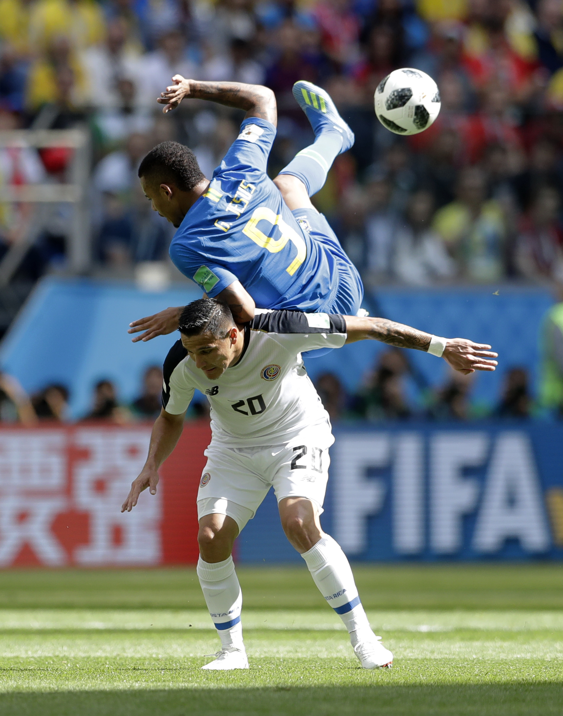 <div class='meta'><div class='origin-logo' data-origin='none'></div><span class='caption-text' data-credit='Petr David Josek/AP Photo'>Brazil's Gabriel Jesus, top, falls after jumping for a header with Costa Rica's David Guzman during the group E match between Brazil and Costa Rica on June 22.</span></div>