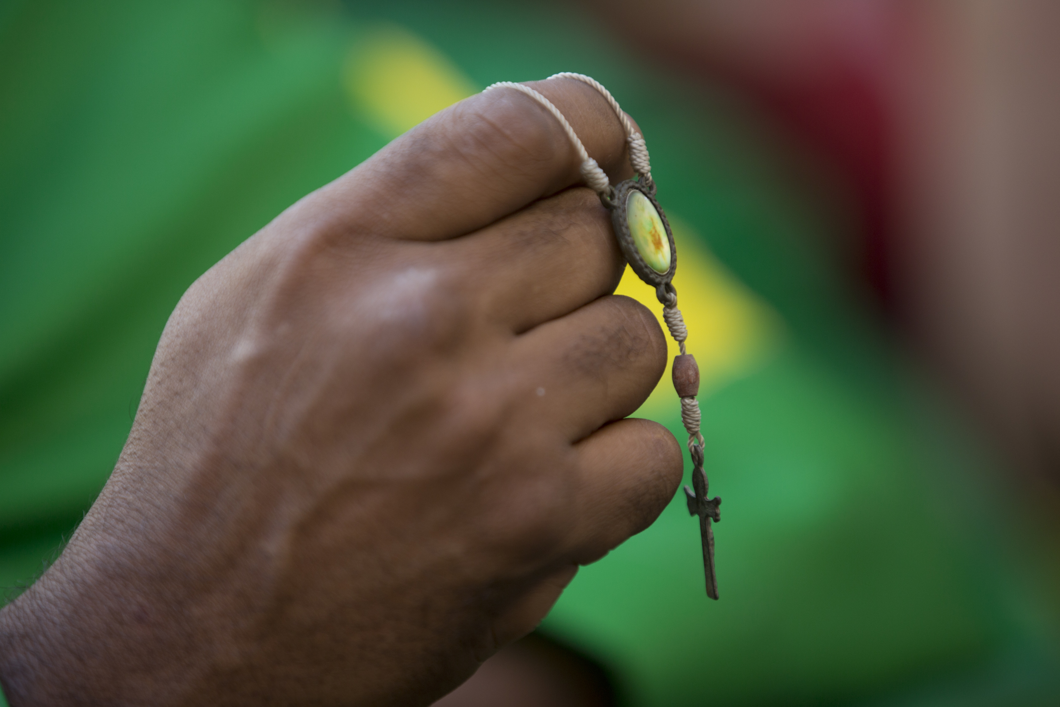<div class='meta'><div class='origin-logo' data-origin='none'></div><span class='caption-text' data-credit='Silvia Izquierdo/AP Photo'>A Brazil soccer fan holds a cross during his team's World Cup match against Costa Rica in Rio de Janeiro, Brazil, Friday, June 22, 2018.</span></div>