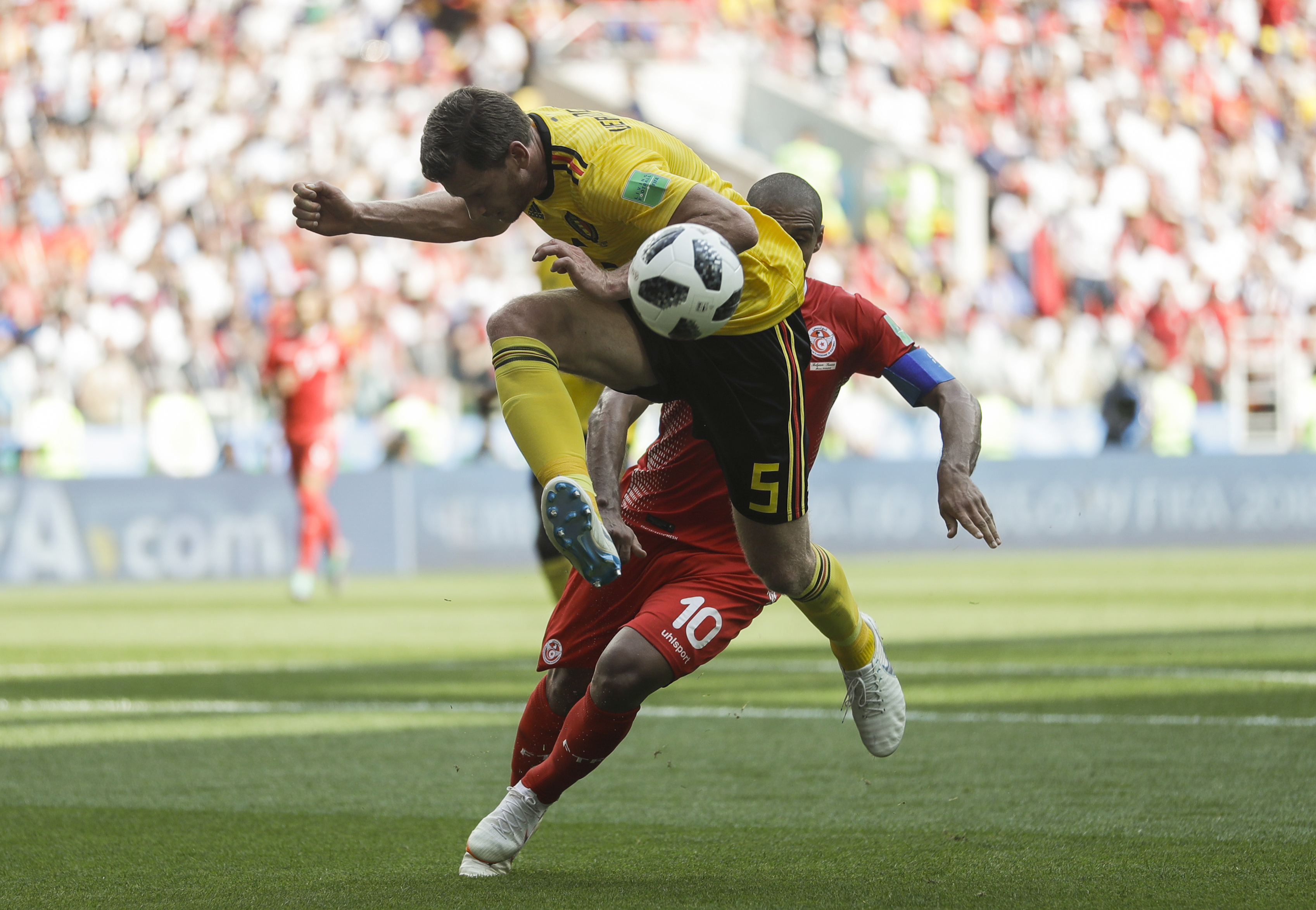 <div class='meta'><div class='origin-logo' data-origin='none'></div><span class='caption-text' data-credit='Matthias Schrader/AP Photo'>Belgium's Jan Vertonghen, top, and Tunisia's Wahbi Khazri challenge for the ball during the group G match in the Spartak Stadium in Moscow, Russia, Saturday, June 23, 2018.</span></div>