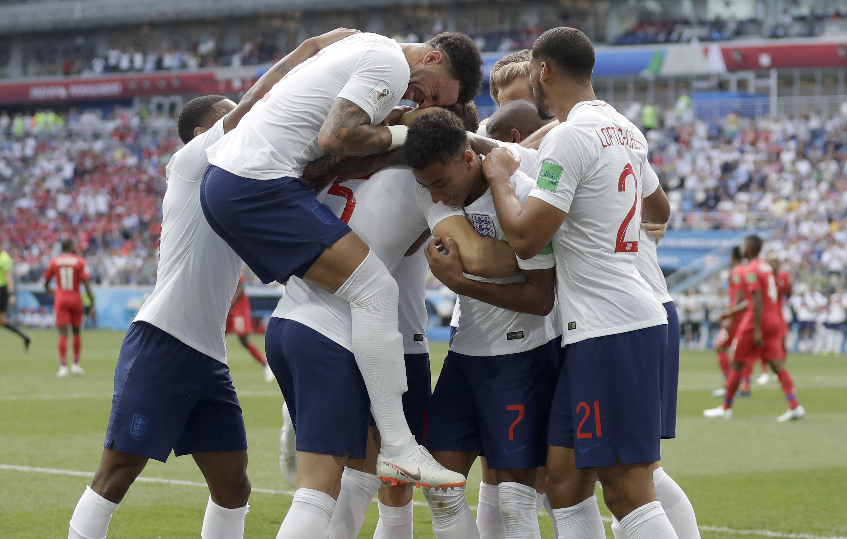 <div class='meta'><div class='origin-logo' data-origin='none'></div><span class='caption-text' data-credit='Matthias Schrader/AP Photo'>England players run to teammate John Stones after he scored his team's first goal during the group G match against Panama at the Nizhny Novgorod Stadium on Sunday, June 24, 2018.</span></div>