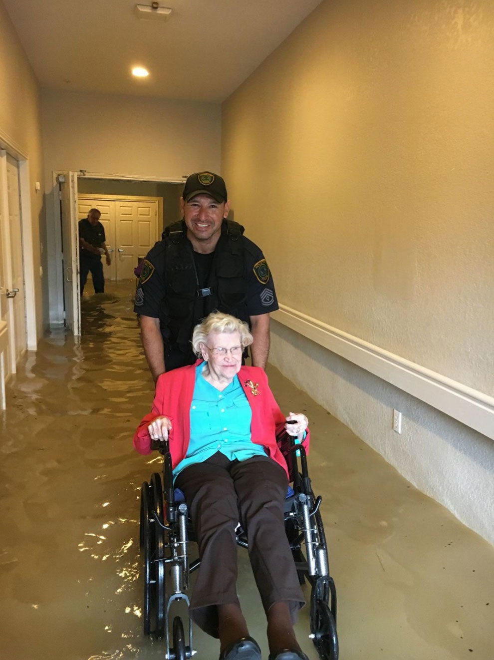 <div class='meta'><div class='origin-logo' data-origin='none'></div><span class='caption-text' data-credit='houstonpolice/Twitter'>The Houston Police rescues a woman stranded by the flood.</span></div>
