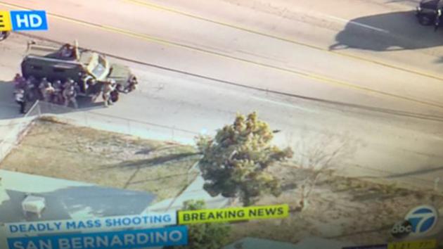 <div class='meta'><div class='origin-logo' data-origin='~ORIGIN~'></div><span class='caption-text' data-credit='ABC7/Twitter'>Law enforcement approaching body near bullet riddled SUV. Long gun next to body.</span></div>