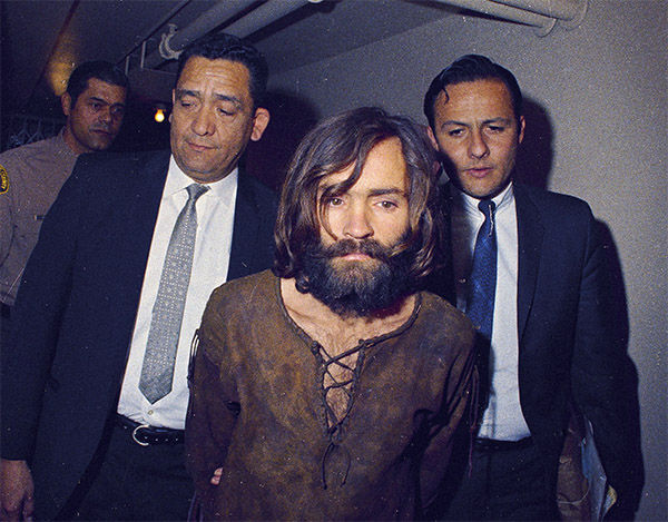 Charles Manson is escorted to his arraignment on conspiracy-murder charges in conneciton with the Sharon Tate murder case, 1969, Los Angeles, Calif. <span class=meta>Photo/AP</span>