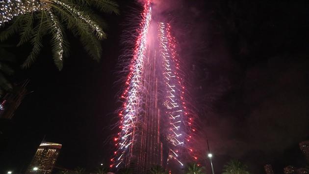 <div class='meta'><div class='origin-logo' data-origin='~ORIGIN~'></div><span class='caption-text' data-credit='AP Photo/Jon Gambrell'>Fireworks illuminate the Burj Khalifa as a tower burns behind it, lower right of tower, in Dubai, United Arab Emirates on Friday, Jan. 1, 2016.</span></div>