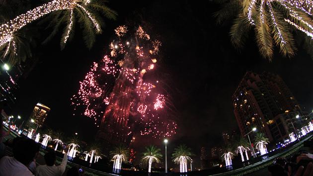 <div class='meta'><div class='origin-logo' data-origin='~ORIGIN~'></div><span class='caption-text' data-credit='AP Photo/Jon Gambrell'>Fireworks illuminate the Burj Khalifa as a tower burns behind it in Dubai, United Arab Emirates on Friday, Jan. 1, 2016.</span></div>