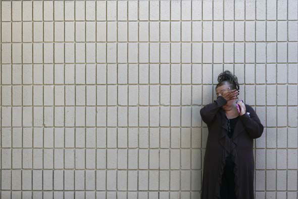 <div class='meta'><div class='origin-logo' data-origin='~ORIGIN~'></div><span class='caption-text' data-credit='AP Photo/ Jae C. Hong'>A woman wipes her tears at a community center where family members are gathering to pick up survivors after a shooting rampage at a social services center in San Bernardino, Calif.</span></div>