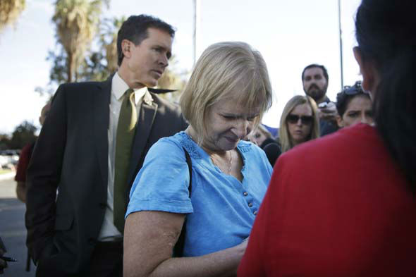 <div class='meta'><div class='origin-logo' data-origin='~ORIGIN~'></div><span class='caption-text' data-credit='AP Photo/ Jae C. Hong'>Sherry Esquerra pauses for a moment while talking to reporters outside a community center where there was a mass shooting in San Bernardino, Calif.</span></div>
