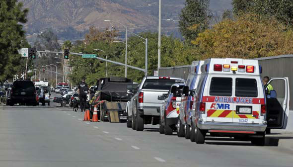 <div class='meta'><div class='origin-logo' data-origin='~ORIGIN~'></div><span class='caption-text' data-credit='AP Photo/ Chris Carlson'>Law enforcement members line up near the the site of a mass shooting on Wednesday, Dec. 2, 2015 in San Bernardino, Calif.</span></div>