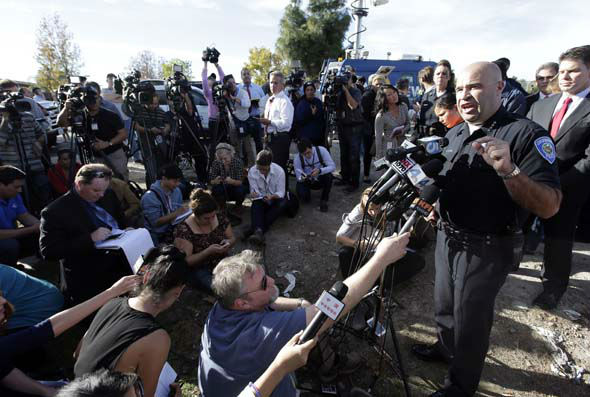 <div class='meta'><div class='origin-logo' data-origin='~ORIGIN~'></div><span class='caption-text' data-credit='AP Photo/ Chris Carlson'>San Bernardino Police Chief Jarrod Burguan, right, talks to the media near the the site of a mass shooting on  Wednesday, Dec. 2, 2015, in San Bernardino, Calif.</span></div>