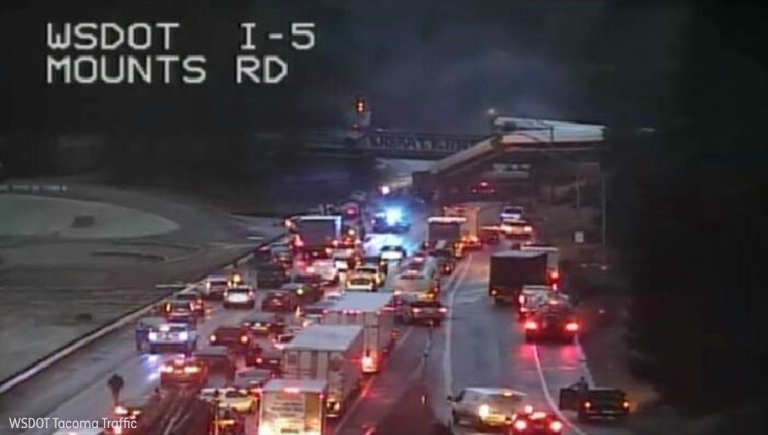 <div class='meta'><div class='origin-logo' data-origin='none'></div><span class='caption-text' data-credit='WSDOT Tacoma Traffic'>An Amtrak train traveling between Seattle and Portland derailed and fell off an overpass onto Interstate-5 south of Tacoma, Washington.</span></div>