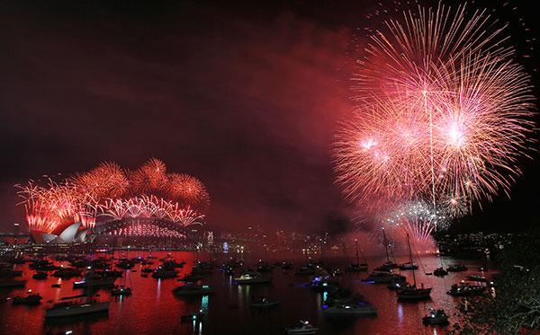 <div class='meta'><div class='origin-logo' data-origin='~ORIGIN~'></div><span class='caption-text' data-credit='AP Photo/Rob Griffith'>Fireworks explode over the Opera House and Harbour Bridge during New Year's Eve fireworks display in Sydney, Australia, Friday, Jan. 1, 2016.</span></div>