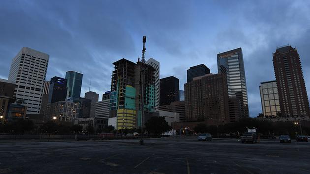 <div class='meta'><div class='origin-logo' data-origin='none'></div><span class='caption-text' data-credit='MARK RALSTON/AFP/Getty Images'>The sun rises over the downtown area as the first days curfew ends after Hurricane Harvey caused heavy flooding in Houston, Texas on August 30, 2017.</span></div>