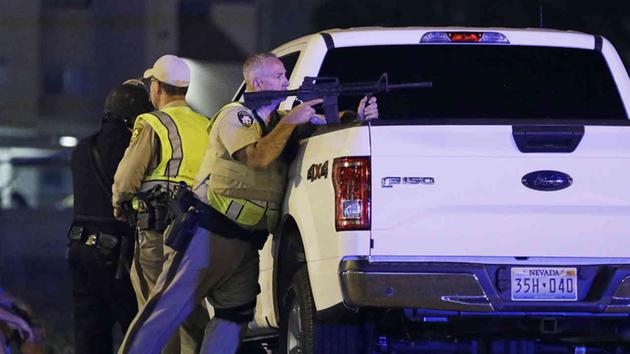 <div class='meta'><div class='origin-logo' data-origin='none'></div><span class='caption-text' data-credit='AP Photo/John Locher'>Police responded to a shooting near the Mandalay Bay resort and casino on the Las Vegas Strip, Sunday, Oct. 1, 2017, in Las Vegas.</span></div>