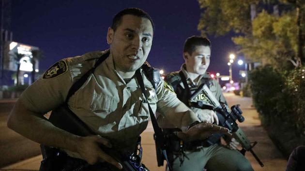 <div class='meta'><div class='origin-logo' data-origin='none'></div><span class='caption-text' data-credit='AP Photo/John Locher'>Police responded to a shooting near the Mandalay Bay resort and casino on the Las Vegas Strip, Sunday, Oct. 1, 2017, in Las Vegas.</span></div>