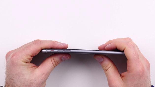 In order to prove claims that the iPhone 6 Plus easily bends if worn in a side pocket, this man records himself bending the phone with just his thumbs. <span class=meta>Unbox Therapy/YouTube</span>