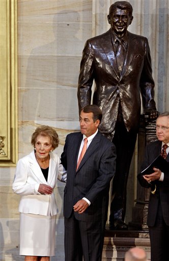 <div class='meta'><div class='origin-logo' data-origin='AP'></div><span class='caption-text' data-credit='AP'>A statue of Ronald Reagan looms in the Capitol Rotunda in Washington DC.</span></div>