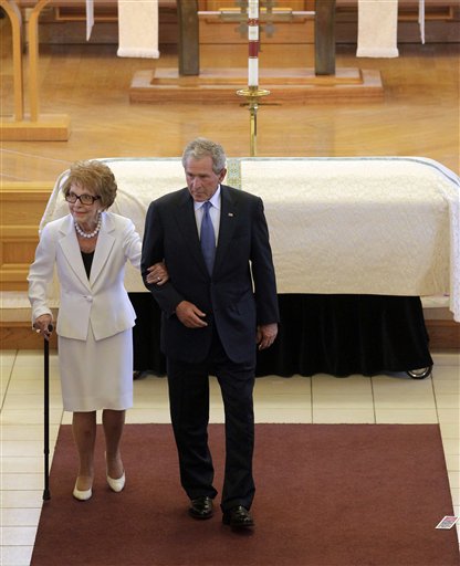 <div class='meta'><div class='origin-logo' data-origin='AP'></div><span class='caption-text' data-credit='ASSOCIATED PRESS'>Former first lady Nancy Reagan, left, is escorted by former President George W. Bush following the funeral for former first lady Betty Ford.</span></div>