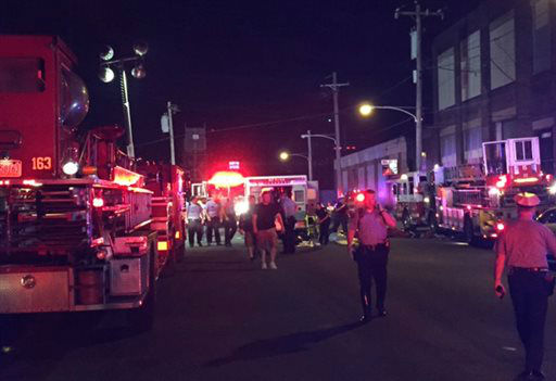 <div class='meta'><div class='origin-logo' data-origin='none'></div><span class='caption-text' data-credit='AP Photo/ Paul Cheung'>Officers gather at the scene of a train crash Tuesday, May 12, 2015, in Philadelphia. An Amtrak train headed to New York City derailed and crashed in Philadelphia.</span></div>
