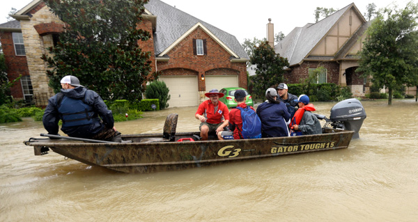 <div class='meta'><div class='origin-logo' data-origin='none'></div><span class='caption-text' data-credit='David J. Phillip/AP Photo'>Residents are evacuated as floodwaters from Hurricane Harvey rise Monday, Aug. 28, 2017, in Spring, Texas.</span></div>