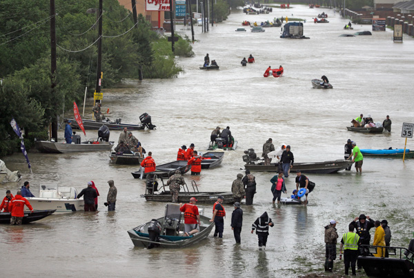 <div class='meta'><div class='origin-logo' data-origin='none'></div><span class='caption-text' data-credit='David J. Phillip/AP Photo'>Rescue boats fill Tidwell Road as they help flood victims evacuate as floodwaters from Hurricane Harvey rise Monday, Aug. 28, 2017, in Houston.</span></div>