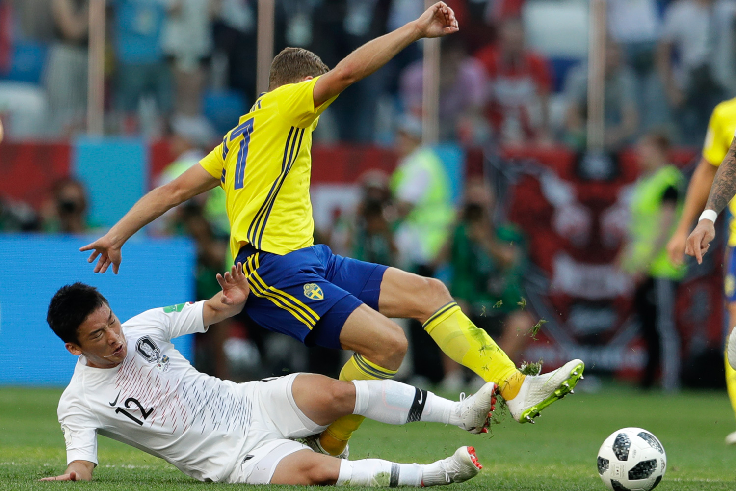 <div class='meta'><div class='origin-logo' data-origin='none'></div><span class='caption-text' data-credit='Petr David Josek/AP'>Sweden's Viktor Claesson is tackled by South Korea's Kim Min-woo during the group F match between Sweden and South Korea</span></div>