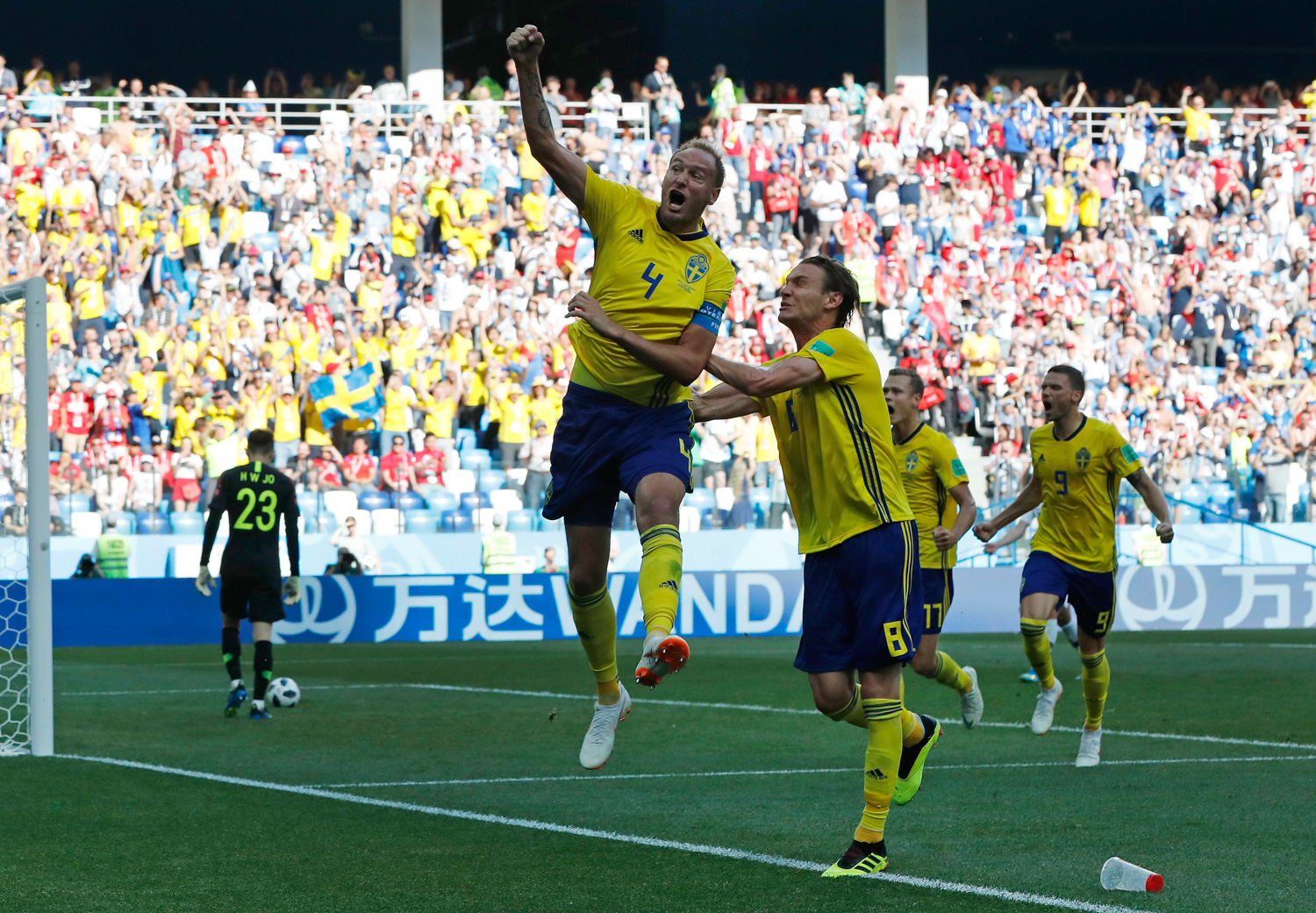 <div class='meta'><div class='origin-logo' data-origin='none'></div><span class='caption-text' data-credit='Pavel Golovkin/AP'>Sweden's Andreas Granqvist, centre, celebrates after scoring the opening goal during the group F match between Sweden and South Korea at the 2018 soccer World Cup</span></div>