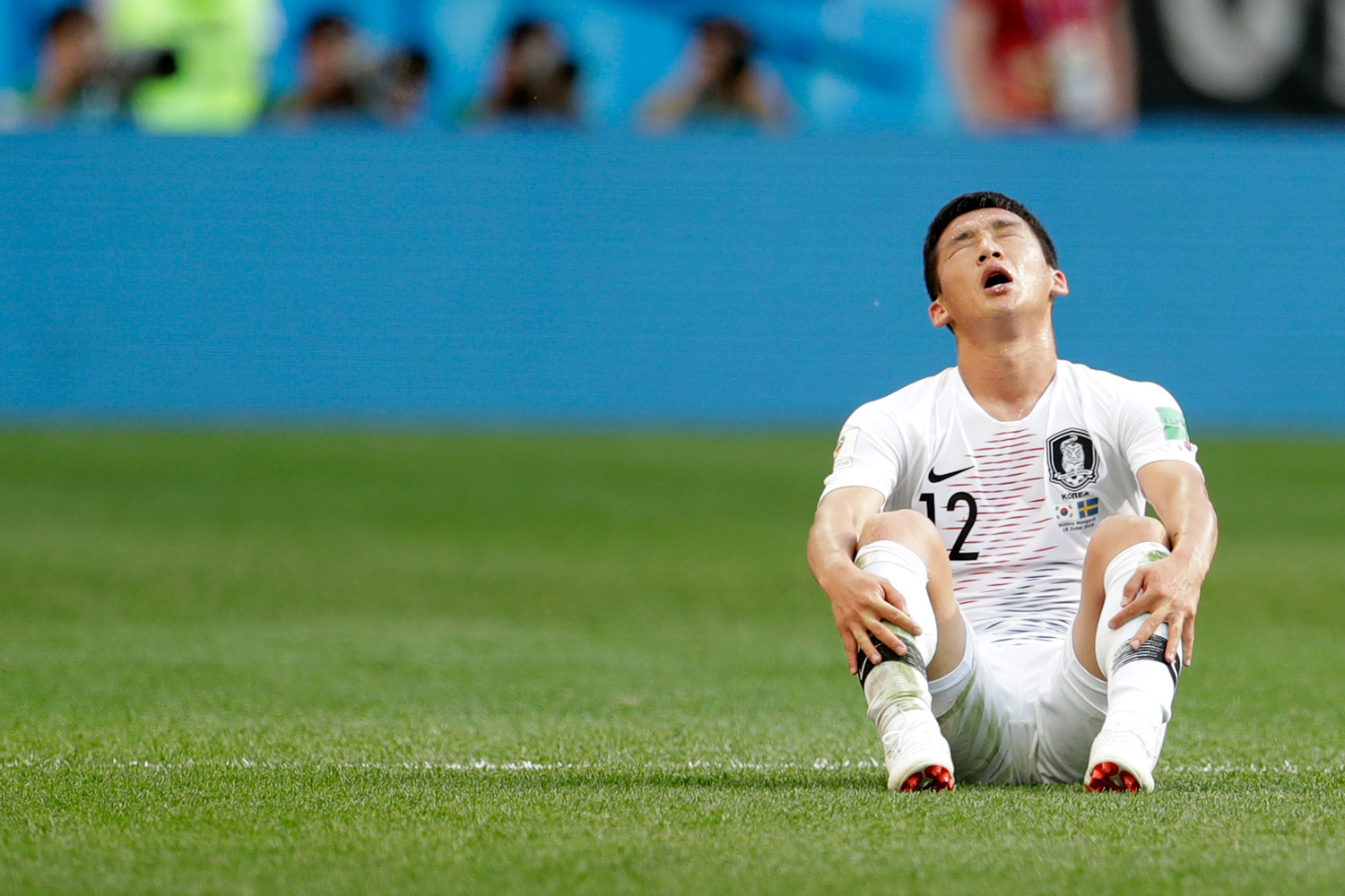 <div class='meta'><div class='origin-logo' data-origin='none'></div><span class='caption-text' data-credit='Petr David Josek/AP'>South Korea's Kim Min-woo sits on the pitch at the end of the group F match between Sweden and South Korea at the 2018 soccer World Cup in the Nizhny Novgorod stadium</span></div>