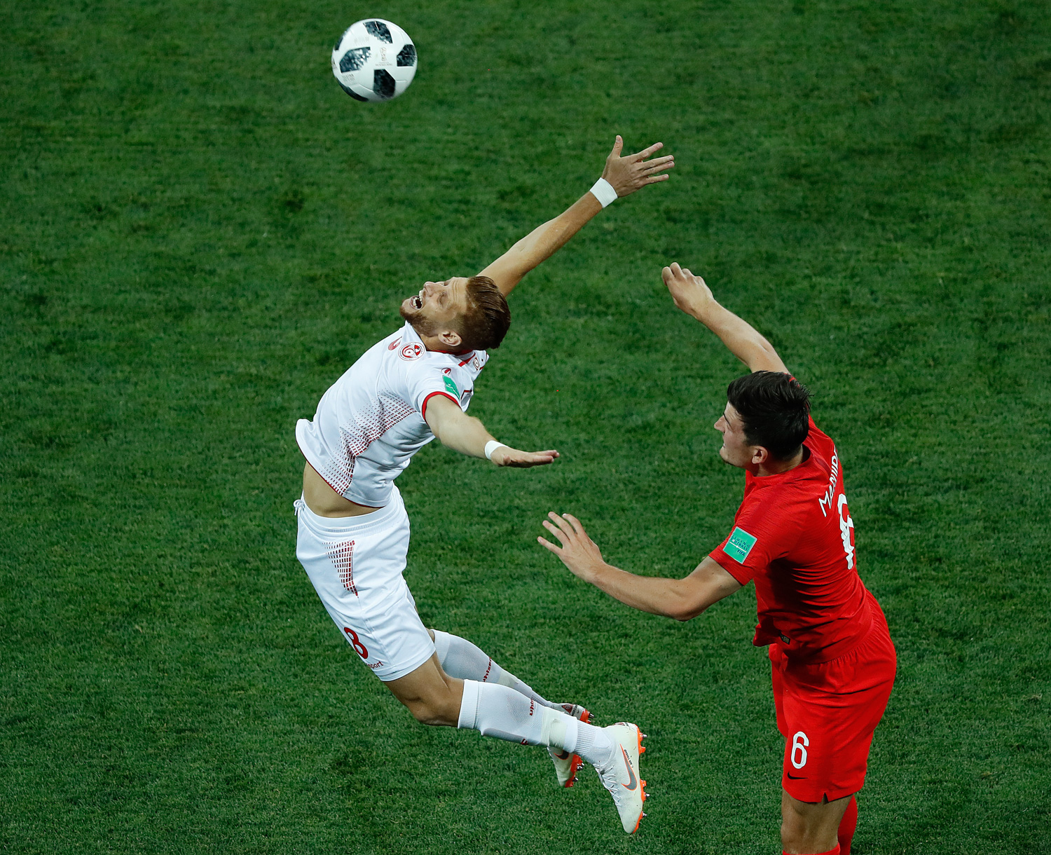 <div class='meta'><div class='origin-logo' data-origin='none'></div><span class='caption-text' data-credit='Rebecca Blackwell/AP Photo'>Tunisia's Rami Bedoui, rich. and England's Jordan Henderson challenge for the ball during the group G match between Tunisia and England</span></div>