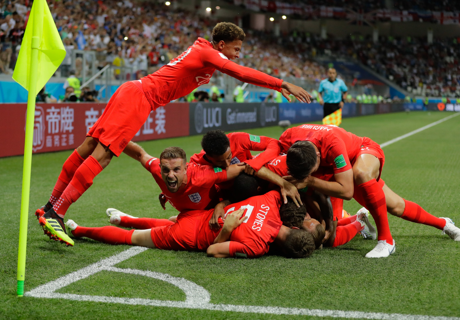 <div class='meta'><div class='origin-logo' data-origin='none'></div><span class='caption-text' data-credit='/Sergei Grits/AP Photo'>England's team celebrate after scoring their side's opening goal against Tunisia during the group G match between Tunisia and England</span></div>