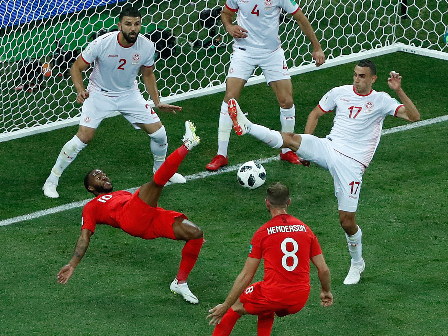 <div class='meta'><div class='origin-logo' data-origin='none'></div><span class='caption-text' data-credit='Rebecca Blackwell/AP Photo'>Tunisia's Ellyes Skhiri, right, and England's Raheem Sterling fight for the ball during the group G match between Tunisia and England</span></div>