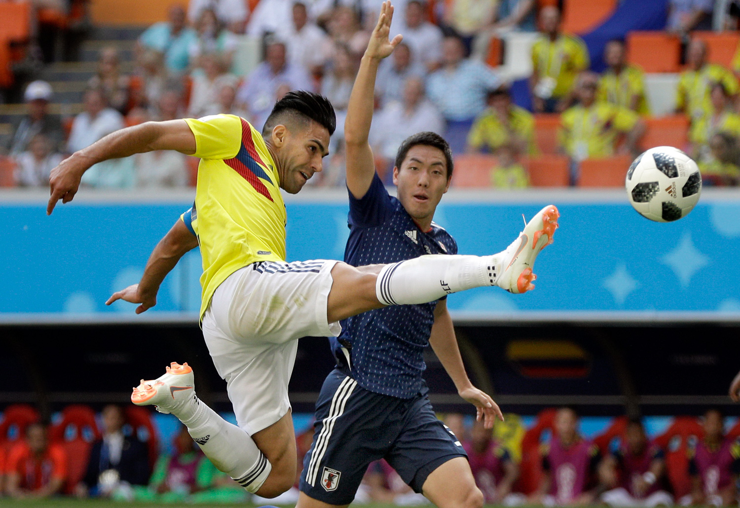 <div class='meta'><div class='origin-logo' data-origin='none'></div><span class='caption-text' data-credit='Mark Baker/AP Photo'>Colombia's Radamel Falcao, left, plays the ball during the group H match between Colombia and Japan at the 2018 soccer World Cup</span></div>