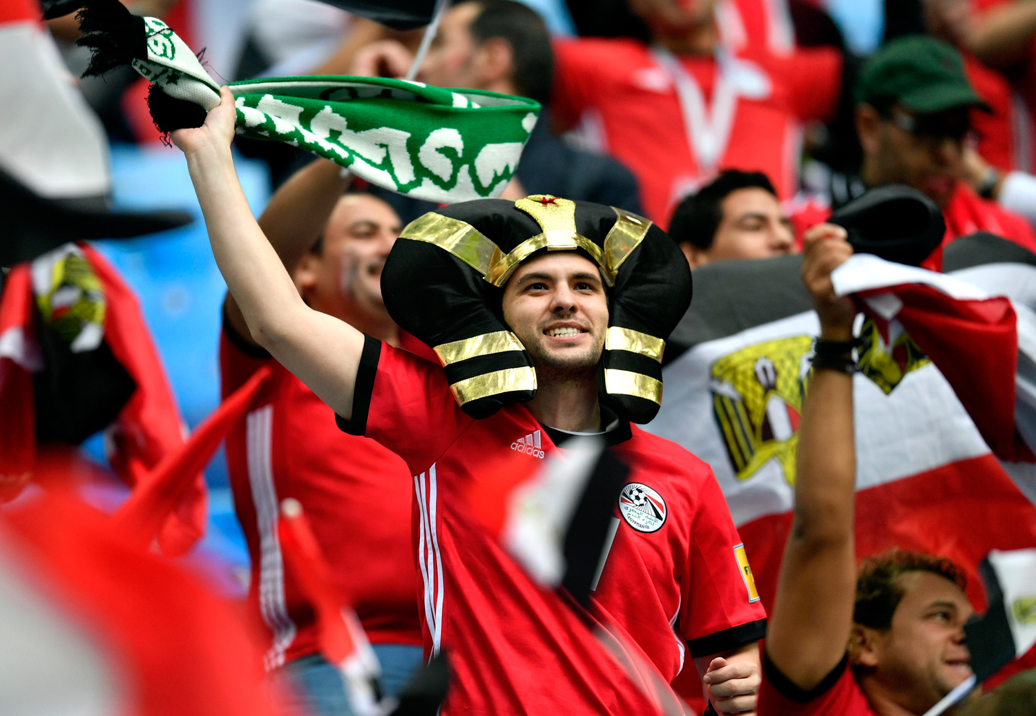 <div class='meta'><div class='origin-logo' data-origin='none'></div><span class='caption-text' data-credit='Martin Meissner/AP'>Supporters cheer prior the group A match between Russia and Egypt at the 2018 soccer World Cup in the St. Petersburg stadium</span></div>