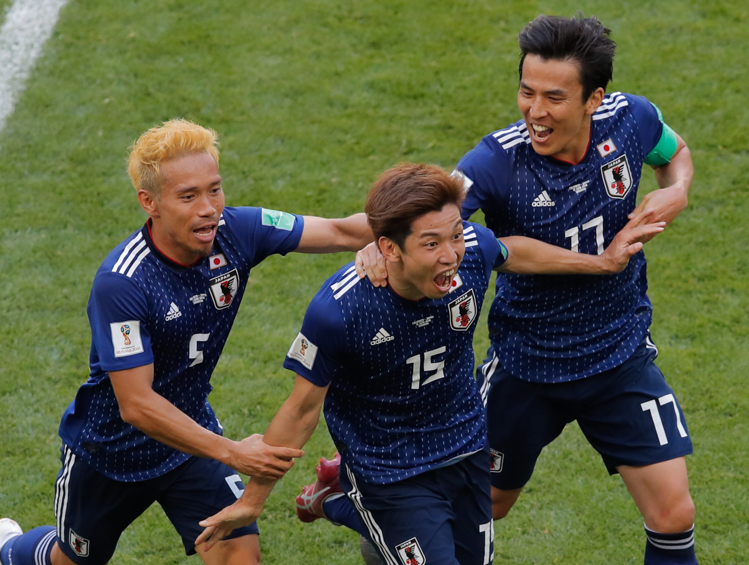 <div class='meta'><div class='origin-logo' data-origin='none'></div><span class='caption-text' data-credit='Vadim Ghirda/AP Photo'>Japan's Yuya Osako celebrates after scoring his side's 2nd goal with teammates Makoto Hasebe, right, and Yuto Nagatomo, left, during the group H match between Colombia and Japan</span></div>