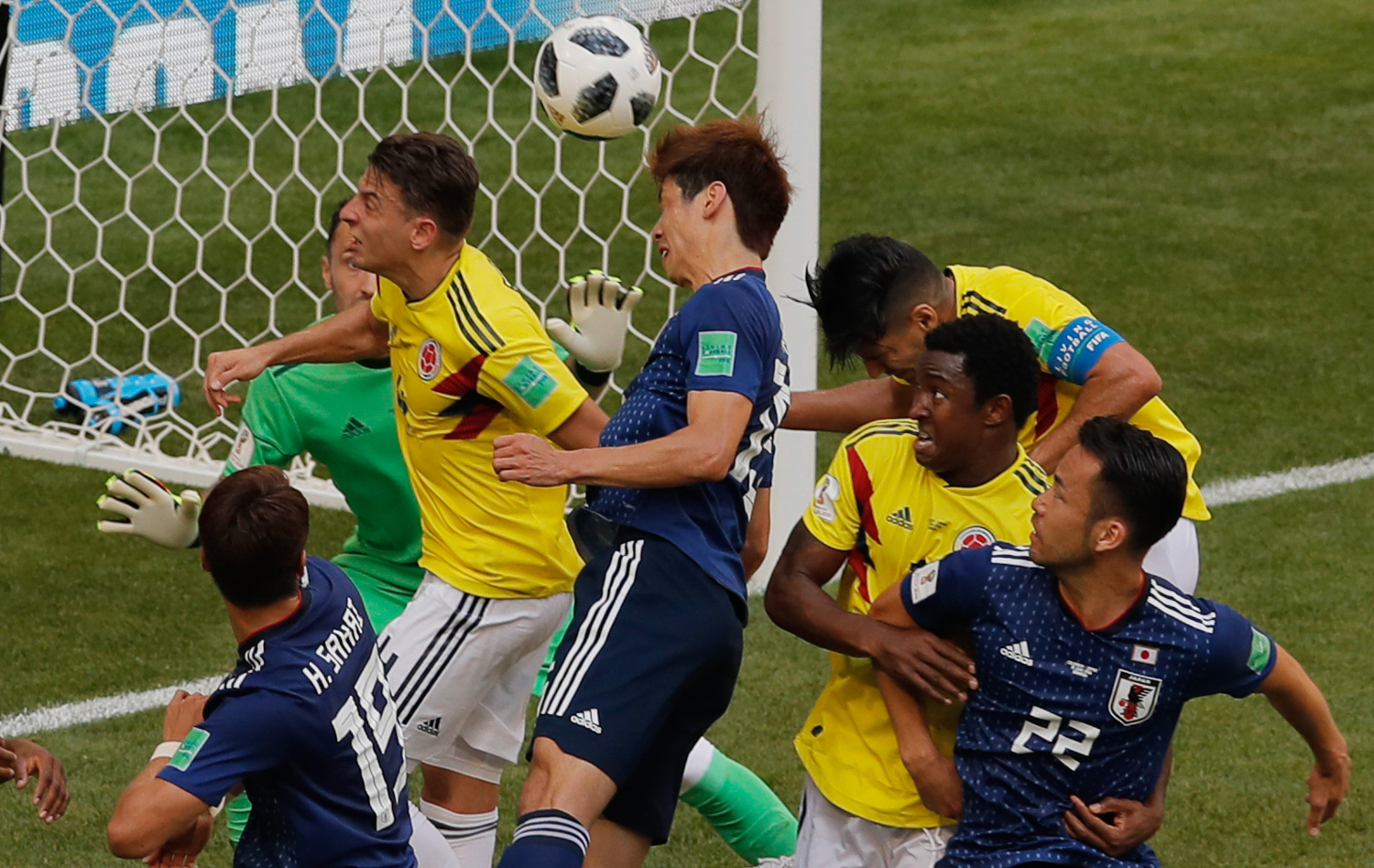 <div class='meta'><div class='origin-logo' data-origin='none'></div><span class='caption-text' data-credit='Vadim Ghirda/AP Photo'>Japan's Yuya Osako, center, scores his side second goal during the group H match between Colombia and Japan</span></div>