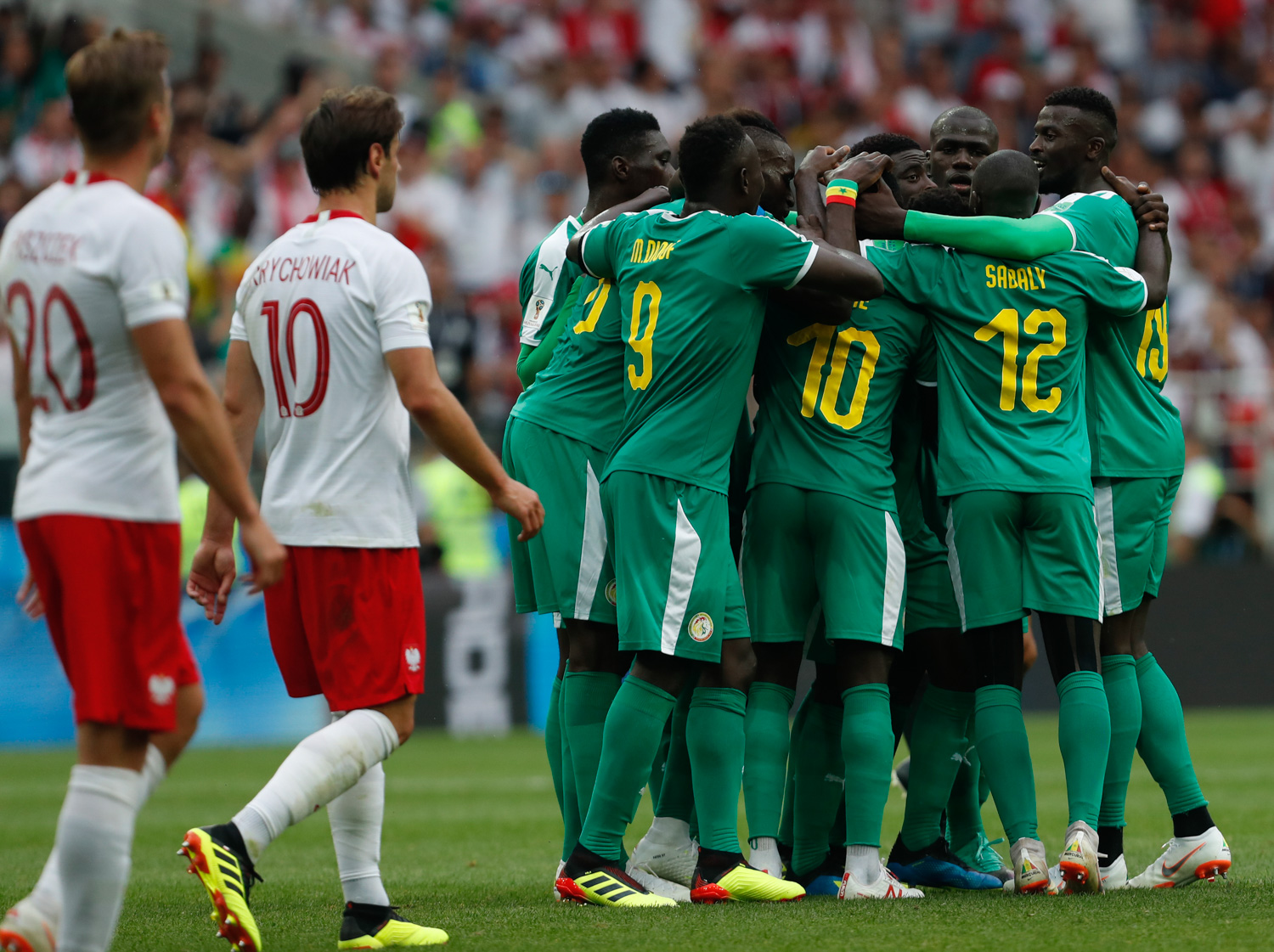 <div class='meta'><div class='origin-logo' data-origin='none'></div><span class='caption-text' data-credit='Darko Vojinovic/AP Photo'>Senegal's Idrissa Gana Guey celebrates with teammates after scoring the opening goal during the group H match between Poland and Senegal</span></div>