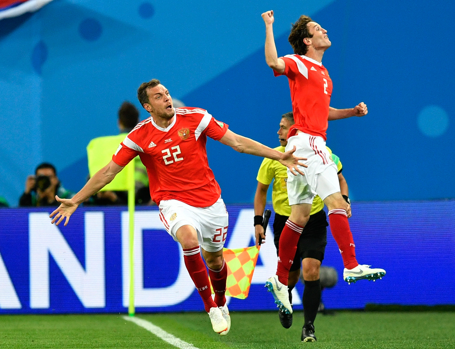 <div class='meta'><div class='origin-logo' data-origin='none'></div><span class='caption-text' data-credit='Martin Meissner/AP'>Russia's Artyom Dzyuba, left, celebrates with Russia's Mario Fernandes , right, after scoring his side's third goal during the group A match between Russia and Egypt</span></div>