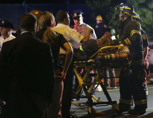 <div class='meta'><div class='origin-logo' data-origin='none'></div><span class='caption-text' data-credit='AP Photo/ Matt Slocum'>Emergency personnel transport a person at the scene of a train wreck, Tuesday, May 12, 2015, in Philadelphia.</span></div>