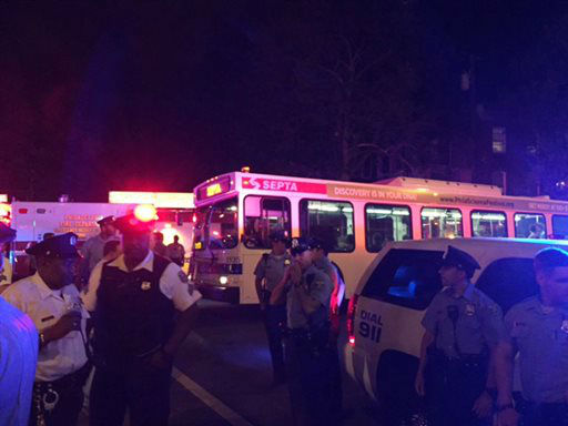 <div class='meta'><div class='origin-logo' data-origin='none'></div><span class='caption-text' data-credit='AP Photo/ Paul Cheung'>Officers gather at the scene of a train crash Tuesday, May 12, 2015, in Philadelphia. An Amtrak train headed to New York City derailed and crashed in Philadelphia.</span></div>